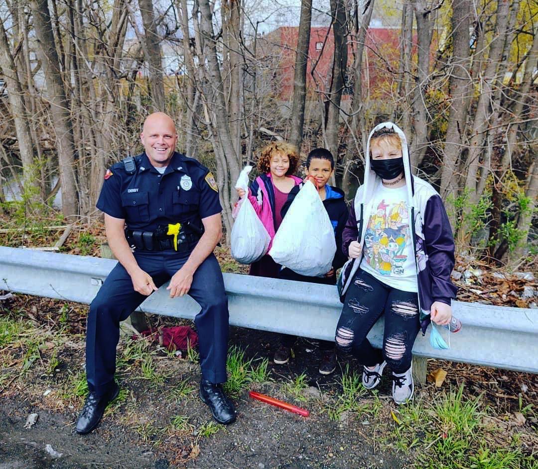 Officer Darren Derby with young cleanup crew