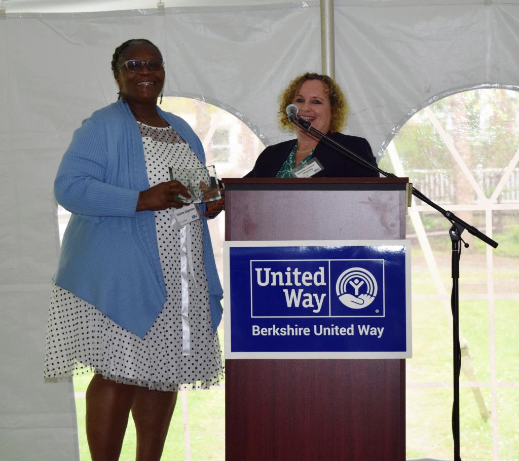 Jennifer Connor-Shumsky (GFCU) presents the Daniel C. Dillon Helping Hands, Caring Heart Award to Shirley Edgerton