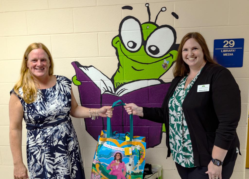 Kerry Light, Williams Elementary School principal, with GFCU's Rebecca Beron