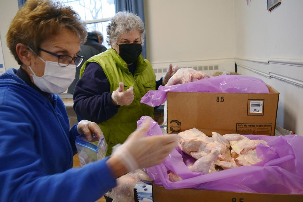 Carol and Joan pack up whole chickens