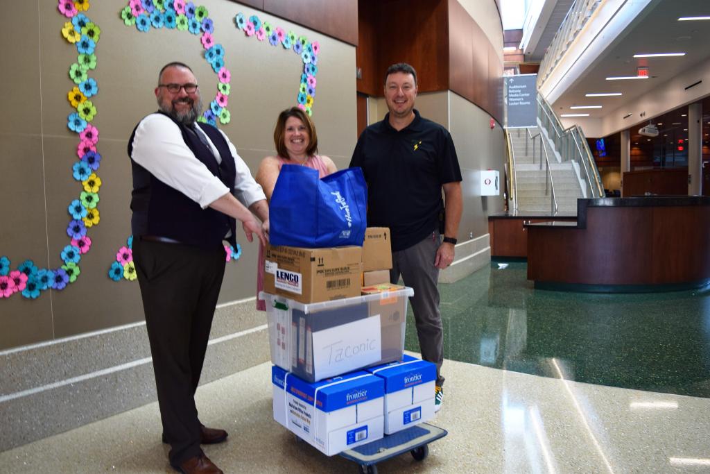 BUW's Tom Bernard and Brenda Petell with Principal Matthew Bishop at Taconic High School