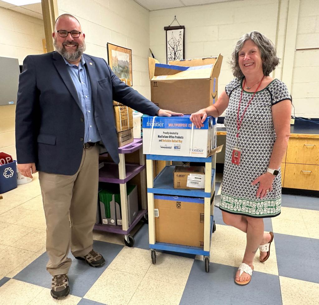 BUW's Tom Bernard and Michelle Monreau, secretary to the principal at Reid Middle School