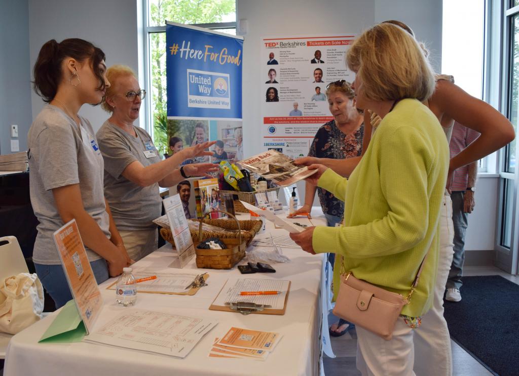 BUW's Pam Knisley and BUW intern Italy check in community members