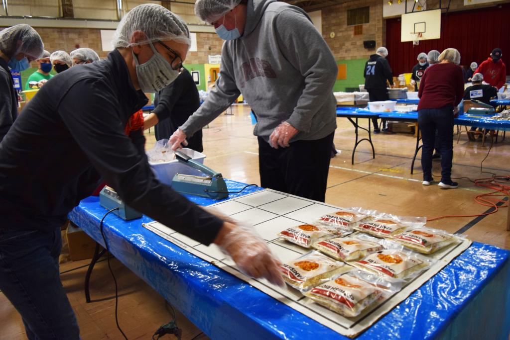 Alex Reczkowski, Berkshire Athenaeum director, packs up Spanish rice