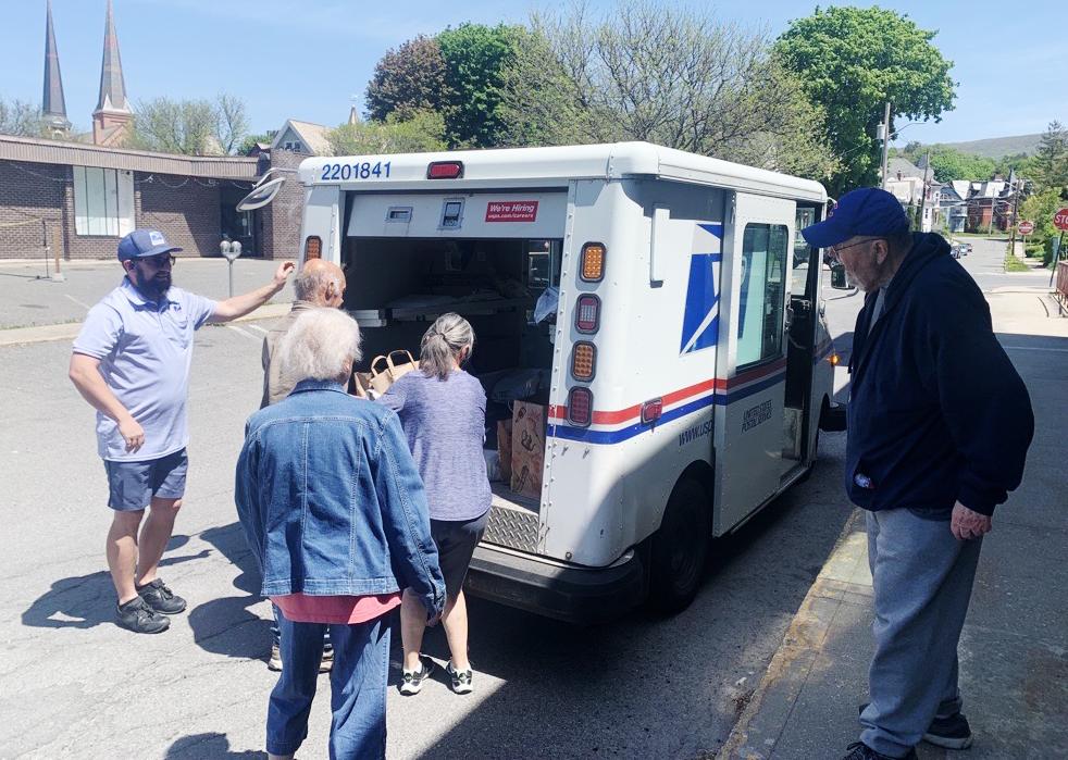 Volunteers help unload in North Adams