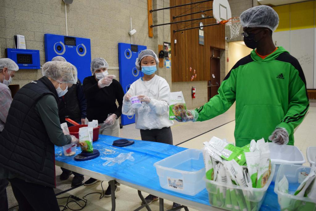 Lisa, a member of the Rotary Interact Club at Pittsfield High, and Caleb, a junior at Taconic High, help out at the Rotary Club table