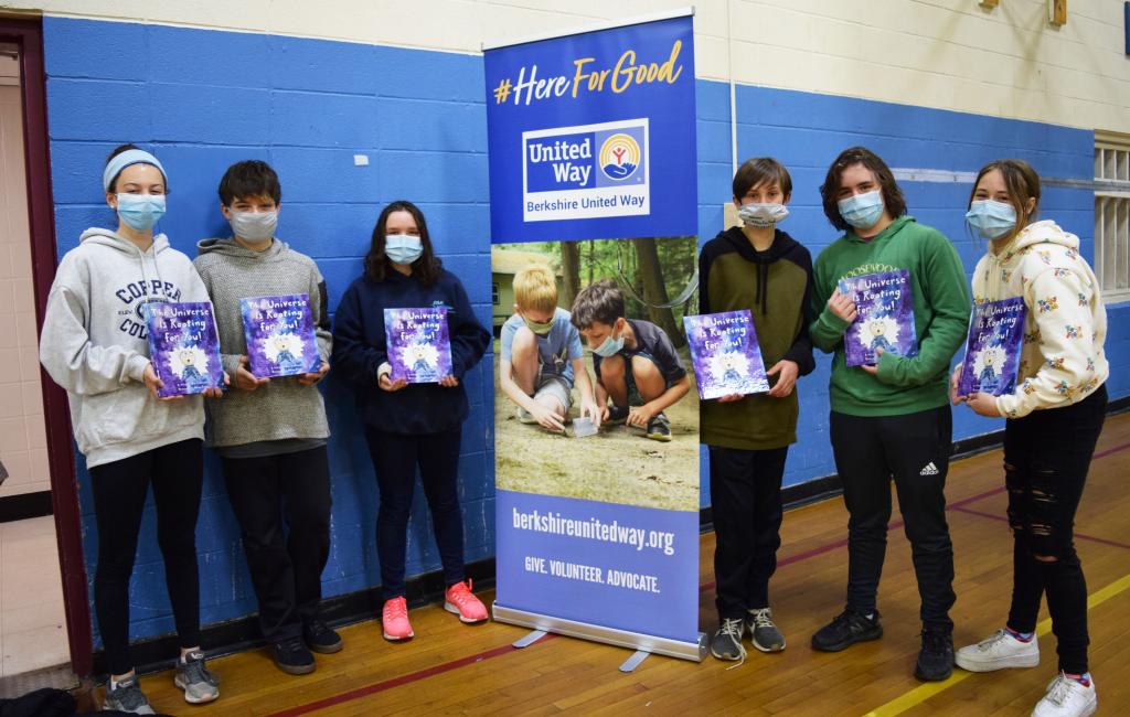 Young volunteers at the StoryWalk™ at YMCA