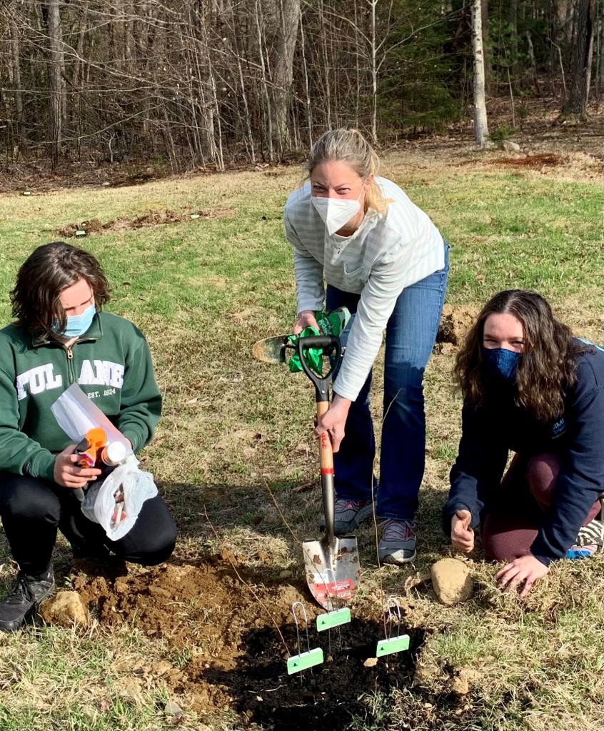 Lenox students and a Lenox parent (no relation) plant trees.