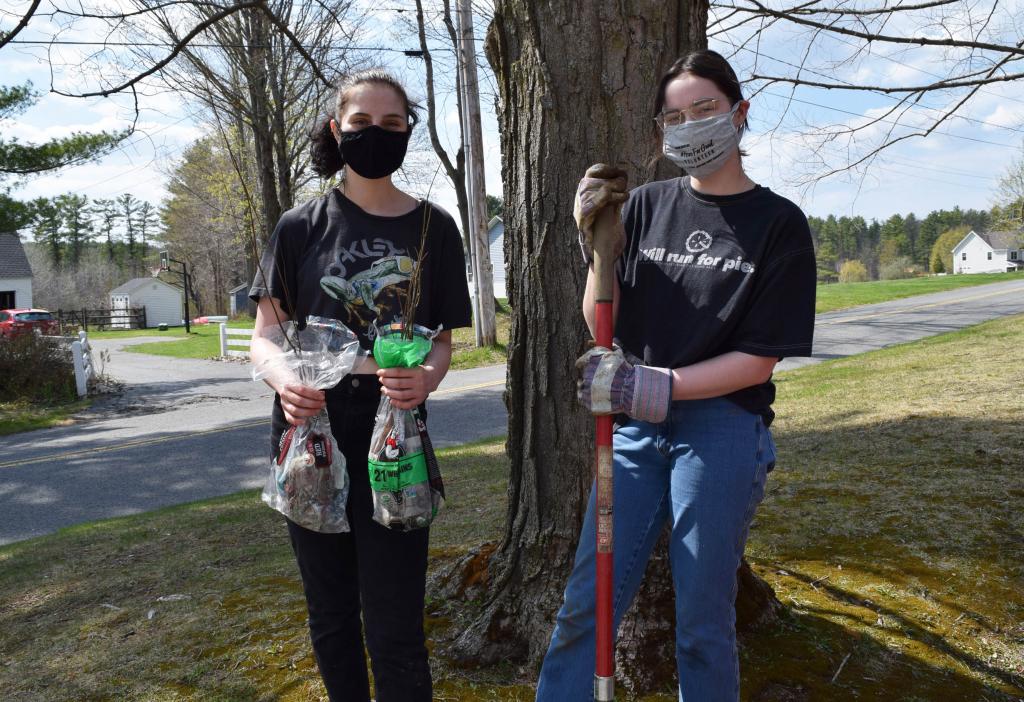 Lenox juniors Chloe and Darby get ready to plant new trees.