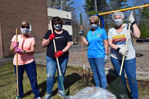 Ladies from Pittsfield UNICO raking leaves at Conte School