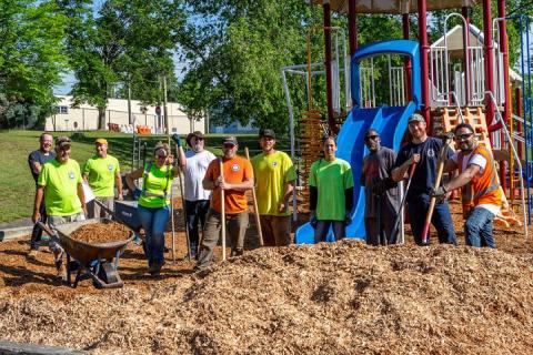 Local 473 volunteers add mulch to playground