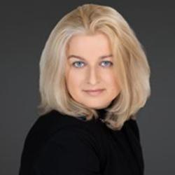 caucasian woman, shoulder length blonde hair, black top